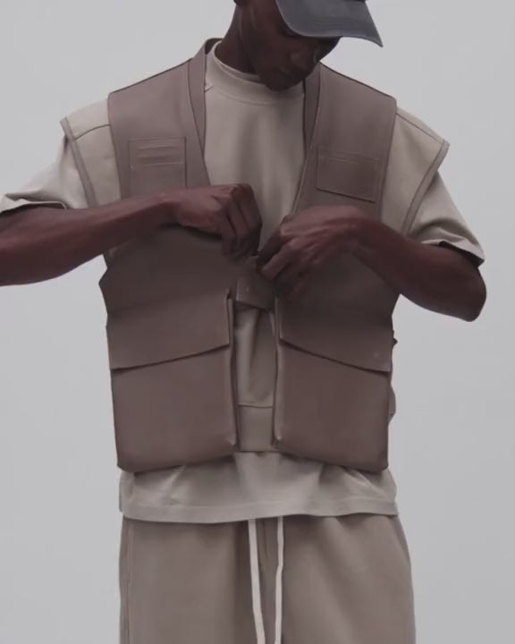 Model showing the pockets and fit of a beige MARR leather vest